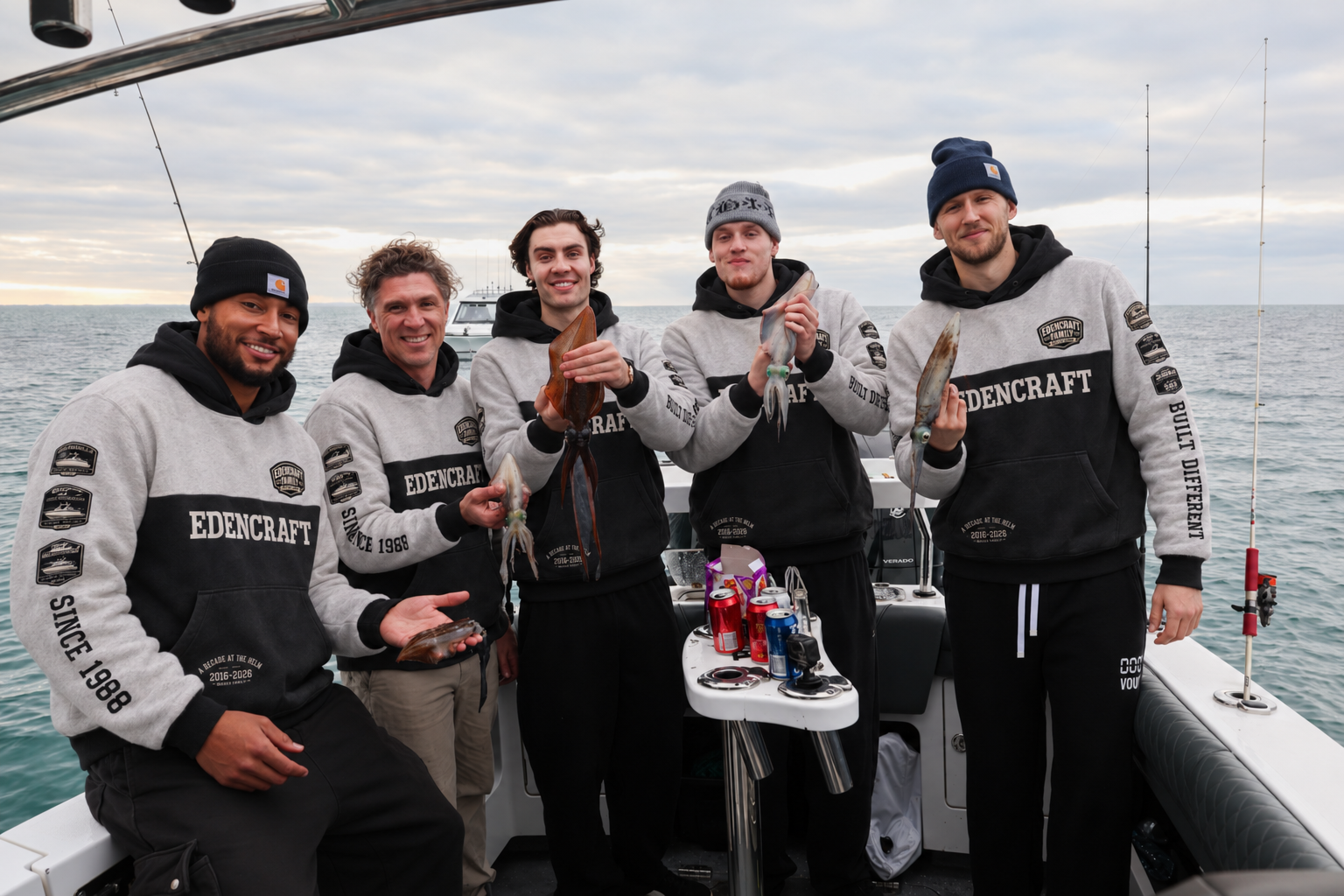 Crew wearing the Edencraft heritage hoodie on the water