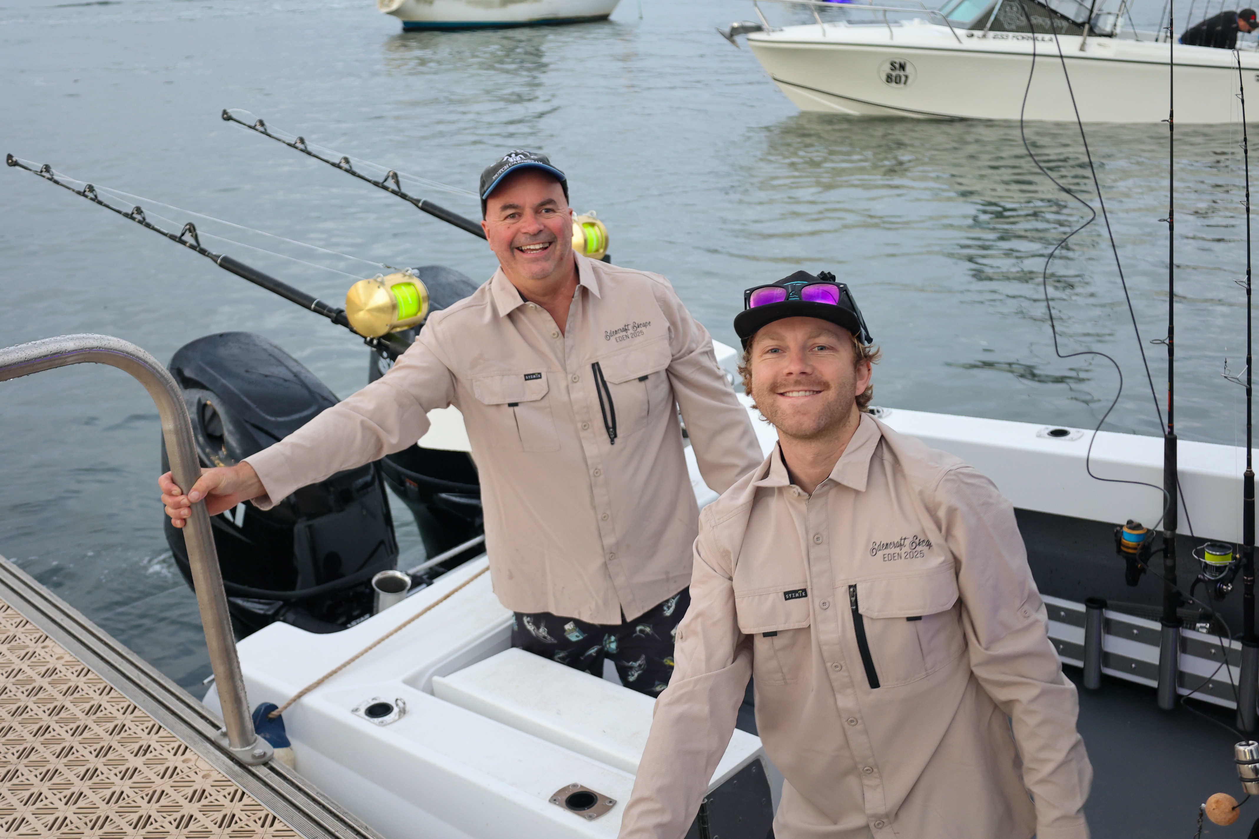 Crew holding squid caught off an Edencraft